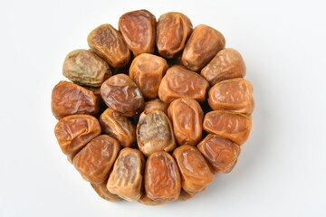 Arabic dates, sugary dates on the white
