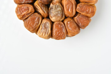 Arabic dates, sugary dates on the white
