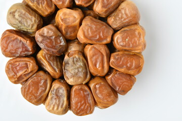 Arabic dates, sugary dates on the white
