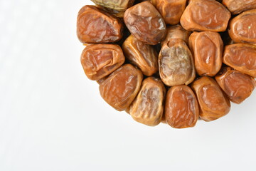 Arabic dates, sugary dates on the white
