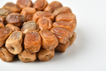 Arabic dates, sugary dates on the white
