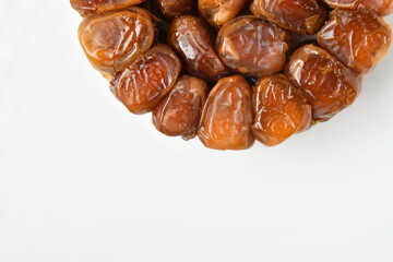 Arabic dates, sugary dates on the white
