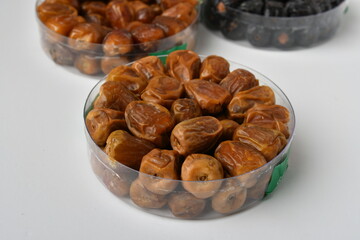 Arabic dates, sugary dates on the white
