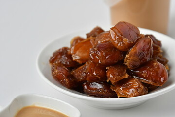 Fresh Arabian dates (Khalas dates ) isolated on white background
