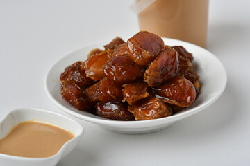 Fresh Arabian dates (Khalas dates ) isolated on white background