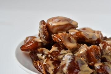 Fresh Arabian dates (Khalas dates ) isolated on white background