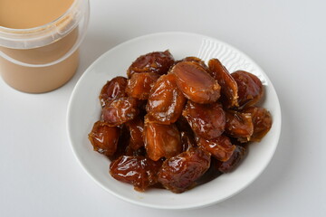 Fresh Arabian dates (Khalas dates ) isolated on white background