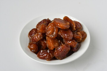 Fresh Arabian dates (Khalas dates ) isolated on white background