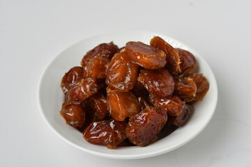 Fresh Arabian dates (Khalas dates ) isolated on white background