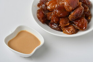 Fresh Arabian dates (Khalas dates ) isolated on white background