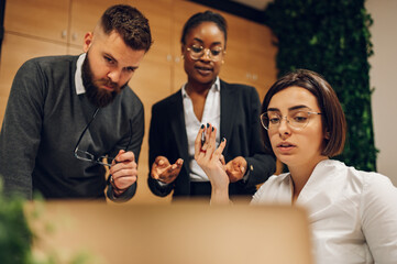 Multicultural team working together in office and having a meeting