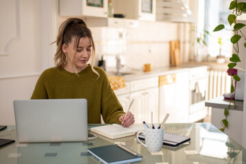 Woman working from a home on her a laptop