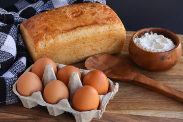Traditional South African baked bread. Freshly baked Ouma bread with baking ingredients including flour and eggs 