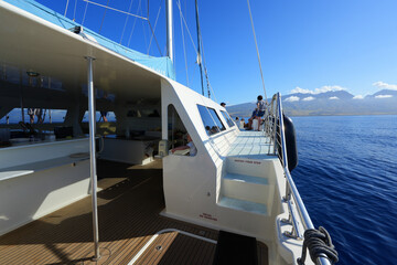 Deck of a Catamaran in the Pacific Ocean between Maui and Lanai islands on the Hawaiian archipelago - Tranquil cruise for whale watching in winter in Polynesia