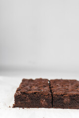 Dark chocolate brownies with caramel on parchment paper