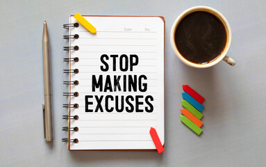 stickers and notepad on a gray background. text on notebook. STOP MAKING EXCUSES