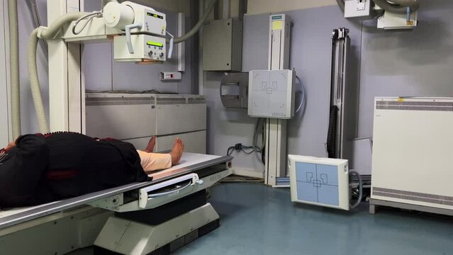 Unrecognizable woman having X-ray scanning session in a public hospital