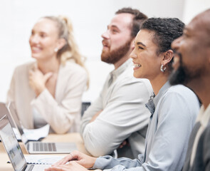 Obraz premium Attention grabbing information. Cropped shot of an attractive young businesswoman and her colleagues sitting in the boardroom during a meeting.