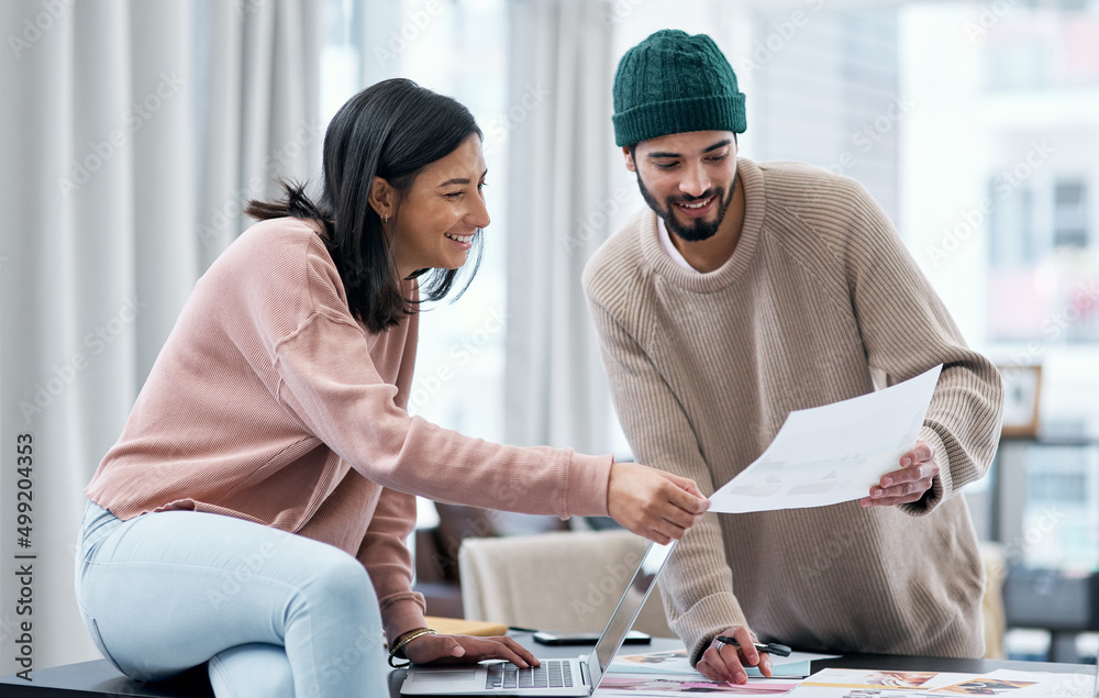 Poster growing a business and a marriage. shot of a young man and woman using a laptop and going though pap