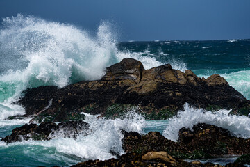 Waves pounding rocky shoreline
