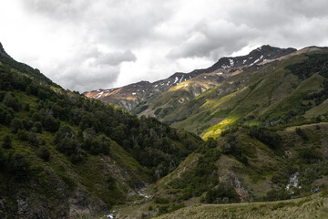 Mountain valley on a cloudy day with river below, Chile