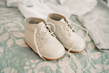 Fototapeta na wymiar White baby shoes