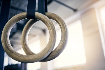 The best equipment to work on both strength and flexibility. Closeup shot of gymnastic rings in a...