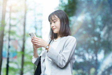 Business woman operating a smartphone