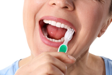 Fototapeta premium Woman brushing teeth with toothbrush, oral hygiene and dental care, healthy lifestyle and fresh breath