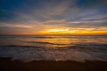 Fototapeta na wymiar beautiful sunset and orange sky by the sea