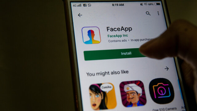 Sungai Buloh, Malaysia - July 20, 2019: An Android user open up Play Store to install FaceApp application with logo on screen. Apps that edit highly realistic transformations of faces in photographs.