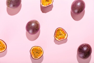 Delicious passion fruits on pink background