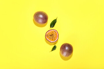 Delicious passion fruits on yellow background