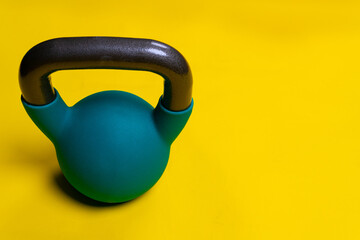 Fototapeta na wymiar For a background Kettlebell Blue text space with yellow on space iron, for object health in equipment from barbell gym, metal simple. Power simplicity hand, medical retro athletic strong
