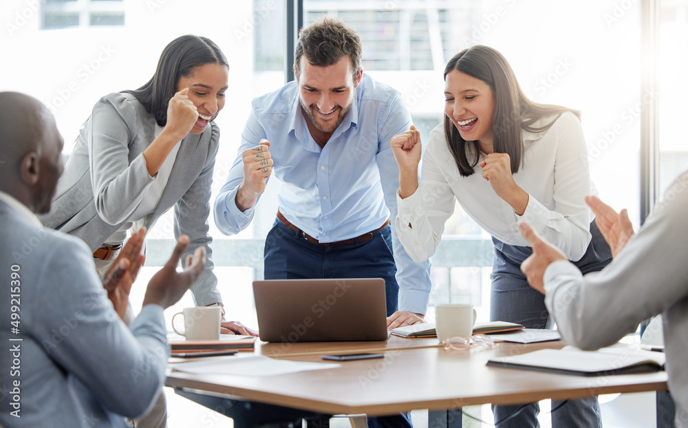 Aufkleber we can do this. shot of a group of businesspeople cheering while using a laptop in an office at work