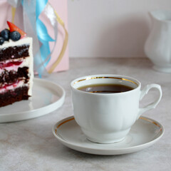 tea in a white cup with a saucer on the table.