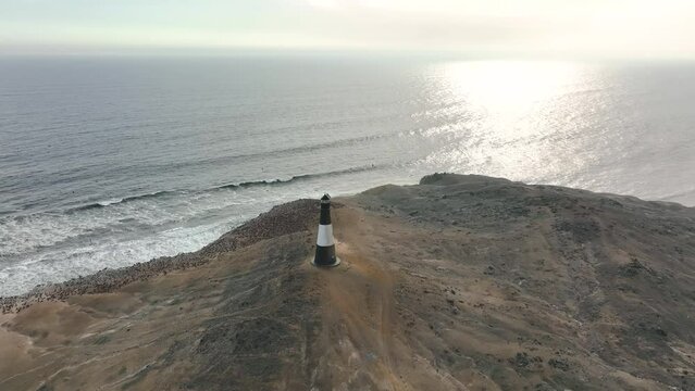 Aerial view of the cliffs and the lighthouse of Puerto Eten, Lambayeque, Peru.
