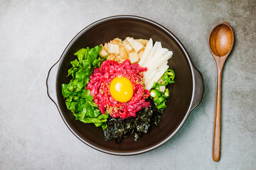 Yukhoebibimbap, Korean style Beef Tartare Bibimbap : This is a bowl of rice topped with seasonal namul (seasoned vegetables) and fresh yukhoe (chopped raw beef) and served with seasoning. Lean fresh r