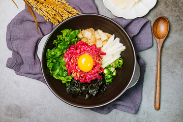 Yukhoebibimbap, Korean style Beef Tartare Bibimbap : This is a bowl of rice topped with seasonal...