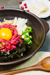 Yukhoebibimbap, Korean style Beef Tartare Bibimbap : This is a bowl of rice topped with seasonal namul (seasoned vegetables) and fresh yukhoe (chopped raw beef) and served with seasoning. Lean fresh r