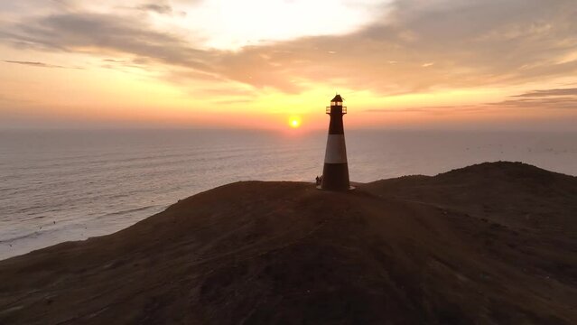 Magical sunset in a lighthouse, the cliffs with sea birds. Puerto Eten at sunset, Lambayeque, Peru