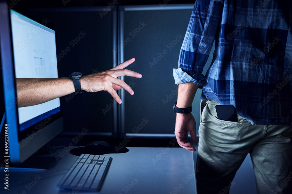 Wall mural No one is safe from cyber crime. Cropped shot of an unrecognizable male hackers hand reaching out from a computer screen.