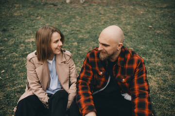 young couple laying on grass. summer love