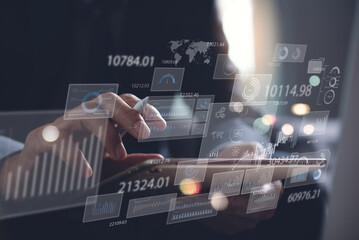 Data analysis, business analytics concept. Businessman working on digital tablet with financial graph, economic growth chart, big data on virtual screen