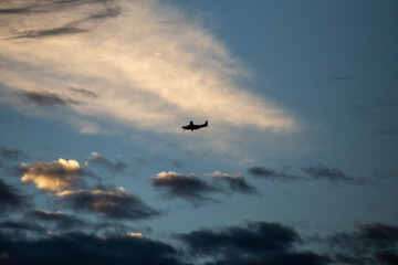 Small Aeroplane in Ominous Clouds Isolated Silhouette