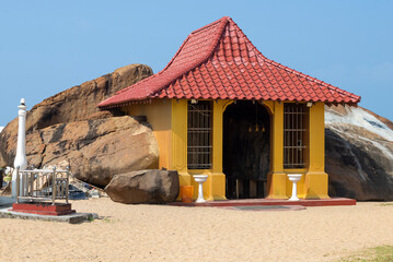 Entrance to the ancient underground Hindu temple of Modara Devalaya on a sunny day. Ambalangoda, Sri Lanka