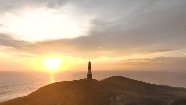 Magical sunset in a lighthouse, the cliffs with sea birds. Puerto Eten at sunset, Lambayeque, Peru