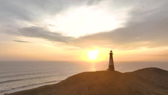 Magical sunset in a lighthouse, the cliffs with sea birds. Puerto Eten at sunset, Lambayeque, Peru
