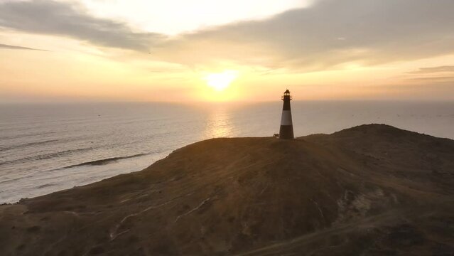 Magical sunset in a lighthouse, the cliffs with sea birds. Puerto Eten at sunset, Lambayeque, Peru
