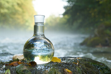 Flask with clear river water.